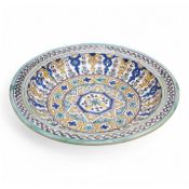 A Moroccan polychrome pottery dish. 36.5cm diameter. Condition - good