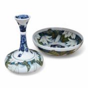 Two pieces of modern Moorcroft Juneberry pattern comprising a bowl and vase by Anji Davenport,