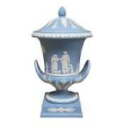 A Wedgwood blue jasper ware twin handled urn and cover, 30cm high. Condition - good