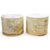 A pair of stamped advertising display Quicke’s Devon England model cheese truckles. 35cm diameter.