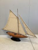 A brass mounted pond yacht, height 118cm. Condition - fair