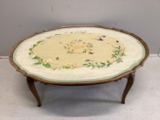 An oval painted walnut coffee table, (cut down), width 124cm, depth 98cm, height 46cm. Condition -
