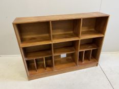 A mid century teak open bookcase, width 132cm, depth 29cm, height 100cm. Condition - fair