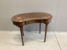 An Edwardian gilt metal mounted coromandel banded rosewood kidney shaped writing table, width 100cm,