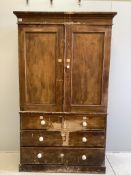 A Victorian pine linen press with painted simulated grain, width 119cm, depth 51cm, height 200cm.