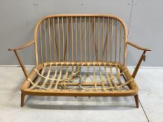 An Ercol light beech three piece suite, settee width 134cm, depth 74cm, height 78cm. Condition -