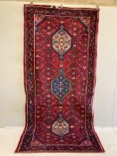 A Hamadan red ground hall carpet, 300 x 135cm. Condition - fair to good