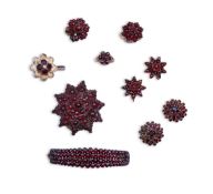 A suite of garnet and paste jewellery, comprising: a brooch, 5cm diameter; a bangle, inner circumfer
