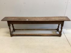 A 17th century style oak bench seat, width 181cm, depth 27cm, height 54cm. Condition - fair
