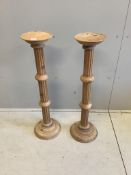 A pair of 19th century style stripped pine torcheres, height 100cm. Condition - fair