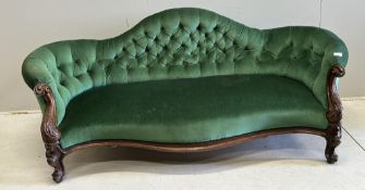 A Victorian rosewood scroll arm deep back buttoned settee, width 184cm, depth 76cm, height 74cm. Con