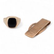 A 1980's 9ct gold tie clip, 39mm and a similar 9ct gold and black onyx set signet ring, gross weight