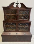 A George III style mahogany three section bookcase / cabinet, incorporating old timber, width 126cm,