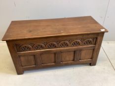 A reproduction 18th century style carved oak coffer, width 106cm, depth 46cm, height 54cm together w
