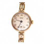 A lady's 9ct gold Vertex manual wind wrist watch, with Arabic dial and subsidiary seconds, on a 9ct