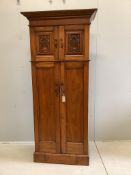 An Art Nouveau walnut gentleman's compactum wardrobe, width 77cm, depth 44cm, height 198cm. Conditio