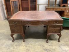 A Chippendale Revival mahogany serpentine partner's kneehole writing desk, width 152cm, depth 118cm,