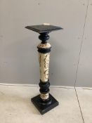 An early 20th century ebonised pottery torchere, width 29cm, height 112cm. Condition - fair