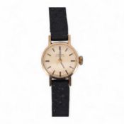 A lady's 9ct gold Omega Automatic wrist watch, on an associated leather strap, gross weight 11 grams