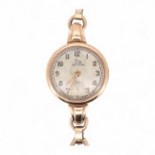 A lady's 9ct gold Record manual wind wrist watch, with Arabic dial and subsidiary seconds, on a 9ct