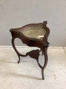 A late Victorian triangular mahogany bijouterie table, width 52cm, height 74cm. Condition - fair