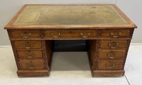 An early 20th century oak pedestal desk, width 136cm, depth 73cm, height 75cm. Condition - fair