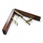 A set of 19th century brass and mahogany folding sovereign scales, 14cm long.