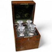 A Victorian burr walnut and brass bound four bottle decanter box, the four faceted square decanters