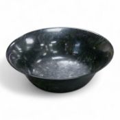 A Chinese spinach green jade bowl, 21cm diameter