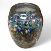 A glass vase possibly by Holmgaard, containing a large collection of late 19th/early 20th century gl