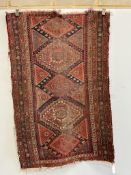 An antique Caucasian blue ground runner and a Caucasian red ground rug (heavily worn), larger 336 x
