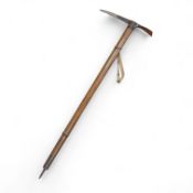 An early 20th century German mountaineer’s ice pick with oak shaft, the head stamped ‘Prima=Garantie