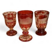 Three Bohemian topographical engraved ruby flashed spa glasses, late 19th century, largest 16cm high
