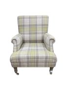 A modern Victorian style wing armchair upholstered in tartan type fabric, width 76cm, depth 76cm, he