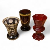 A 19th century Bohemian engraved ruby glass goblet, a similar amethyst and clear overlaid glass vase