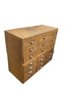 Two mid century pine and ply banks of nine drawers, each width 103cm, depth 45cm, height 43cm