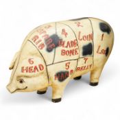 A painted wood butcher’s pig display model, inscribed Hutton’s for Pork and with examples of various
