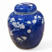 A 19th century Chinese blue and white prunus jar and cover, 15cm high
