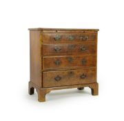 A small early 18th century and later cross and feather banded walnut veneered chest