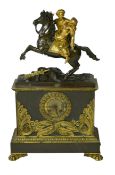 A late nineteenth century brass and bronze cased clock, mounted with a part gilt bronze of a mounted