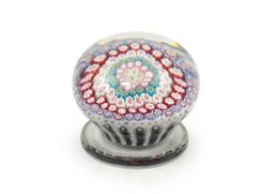 A Clichy piedouche concentric millefiori paperweight, mid 19th century