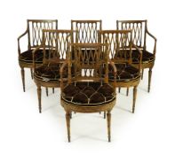 A set of six Sheraton period painted decorated cane seat elbow chairs