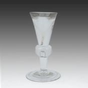 A heavy baluster toastmaster's glass, circa 1715-1720