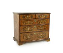 A William and Mary walnut and floral marquetry chest on later bracket feet