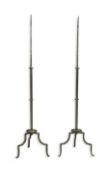 A pair of standing iron pricket candlesticks