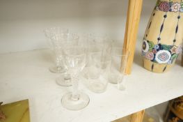 A pair of engraved glass goblets, seven tumblers engraved with the initial G and an air twist stem