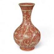 An unusual Delft red and white bottle vase, 16cm high