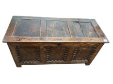 An early 18th century parquetry inlaid panelled oak coffer, width 131cm, depth 54cm, height 64cm