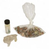 A Chinese carved rock crystal lion, a turquoise bead and a small quantity of marbles, lion 8.5cm