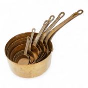 A graduated set of copper saucepans, largest 20.5cm diameter, smallest 6.5cm